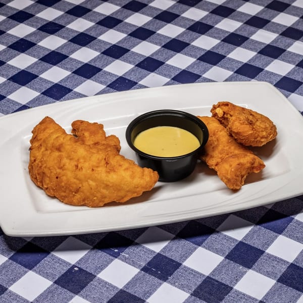Three golden-brown fried chicken tenders with a side of honey mustard sauce on a white plate.